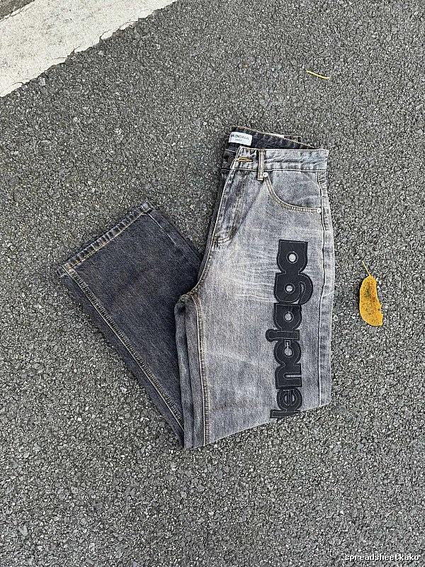 Balenciaga Logo Jeans with large side script branding and a faded leg in Gray Wash